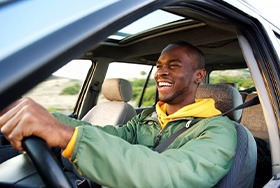 Smiling man drives