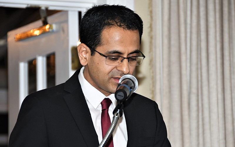 Dr. Ajay speaking at banquet