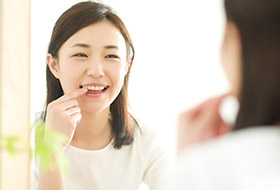 Woman pointing to brilliant smile