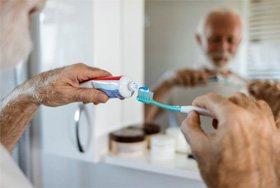 a man getting ready to brush his teeth