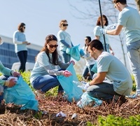 Team members volunteering outdoors