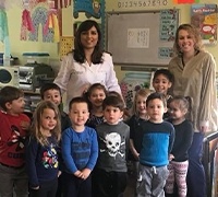 Dentist volunterring with group of children