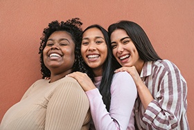 Group of friends smiling outside