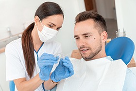 Man and dentist looking at Invisalign together