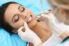 Woman receiving gum disease treatment