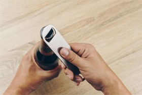 Patient using bottle cap remover