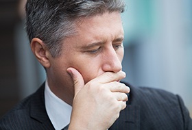 Man covering his mouth