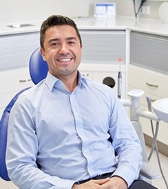 Smiling man in dental chair