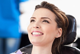 Woman in dental chair smiling