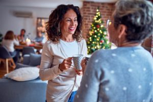 person having a conversation at a holiday party