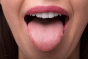 person sticking out their tongue 