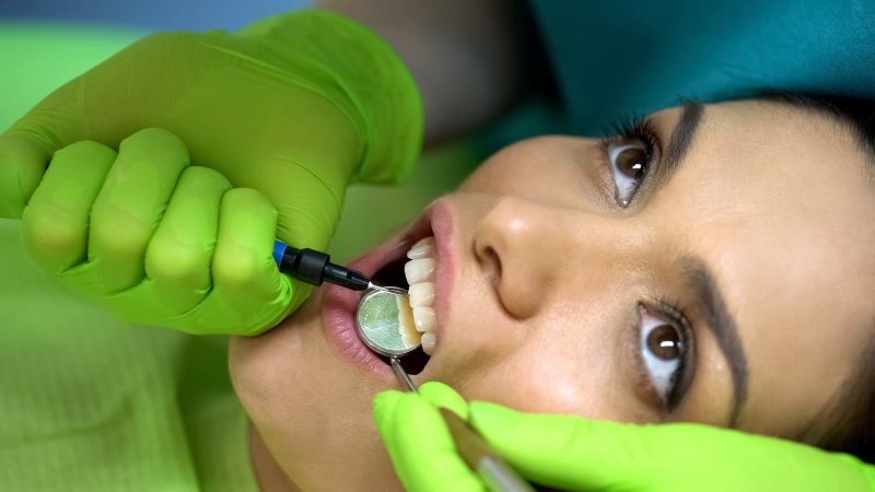Woman with chipped tooth at dentist