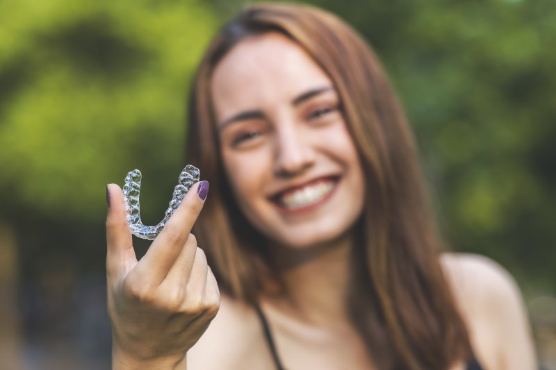 woman with Invisalign in Hartford smiling outside