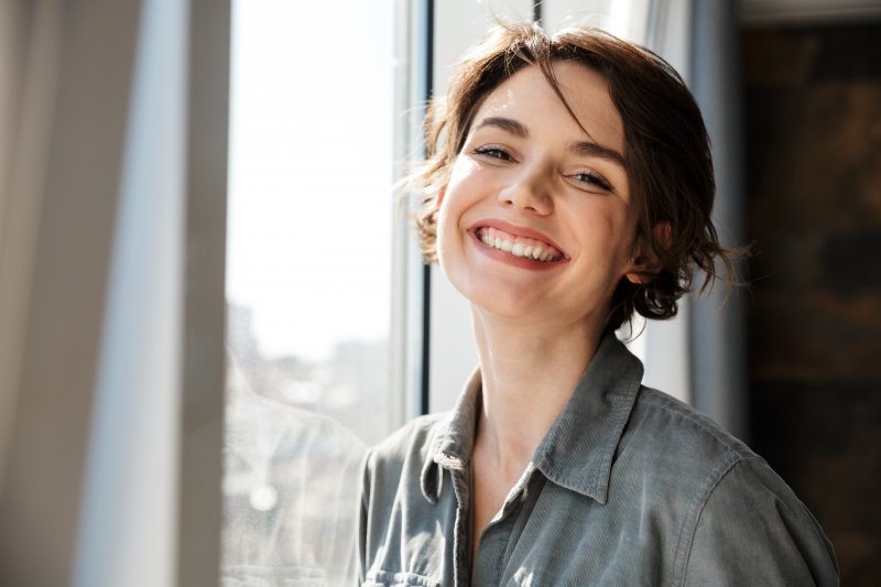 smiling person after getting dental fillings