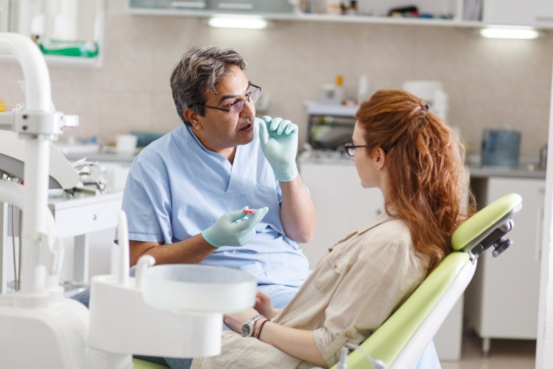 Dentist and patient talking at a dental checkup